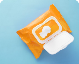 Yellow pack of open wipe package on blue background. 