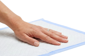 Hand touching a soft underpad