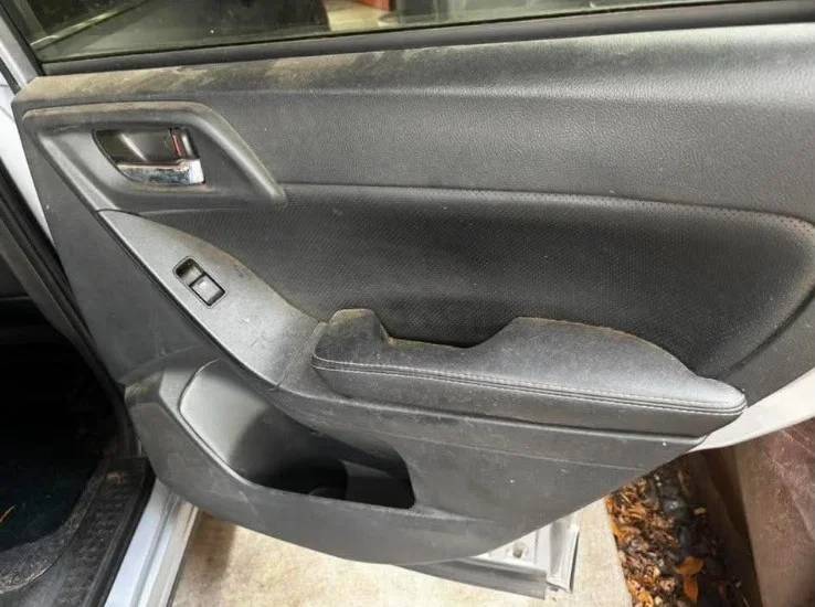 Rivian R1S rear door panel before interior detailing