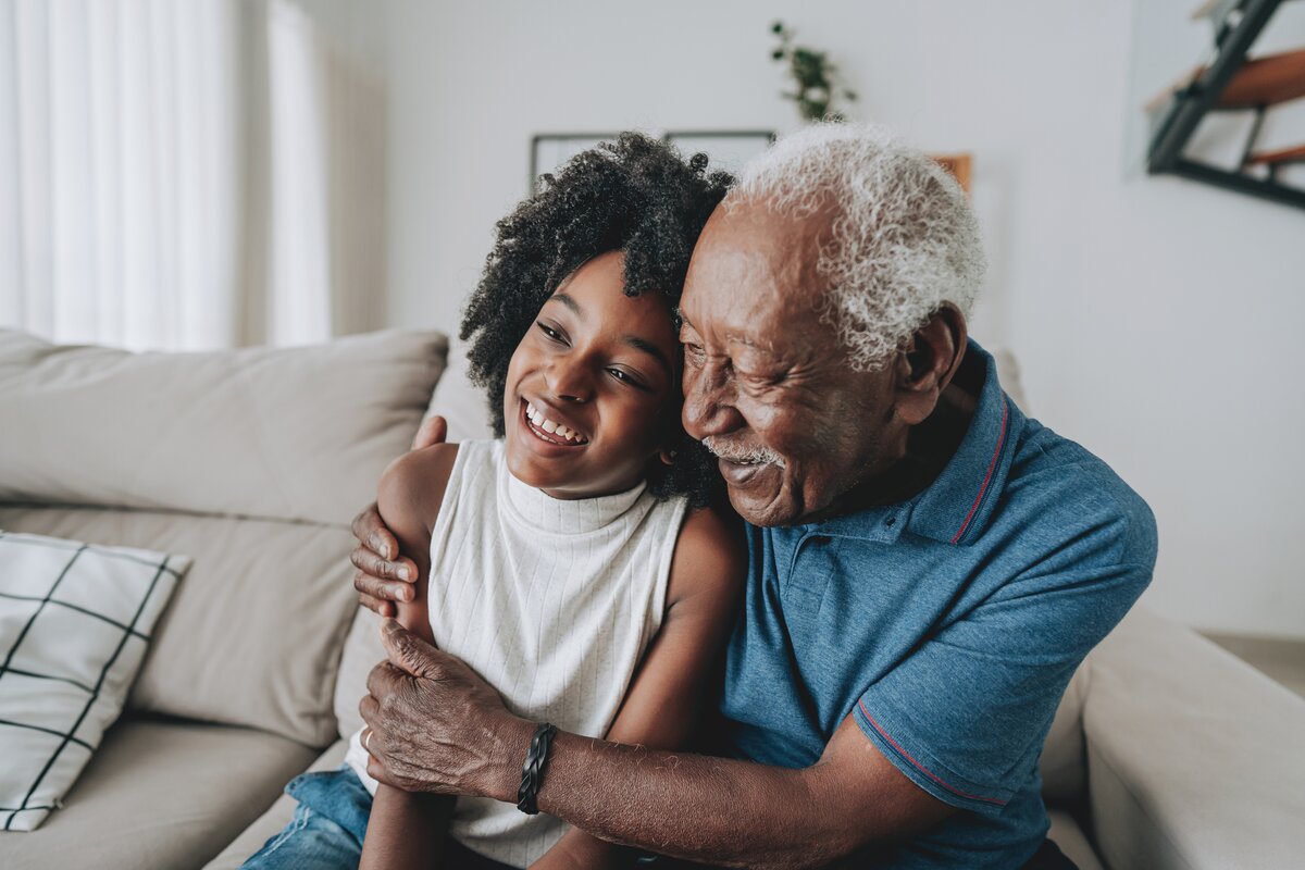 Image of grandfather and granddaughter sharing a happy moment