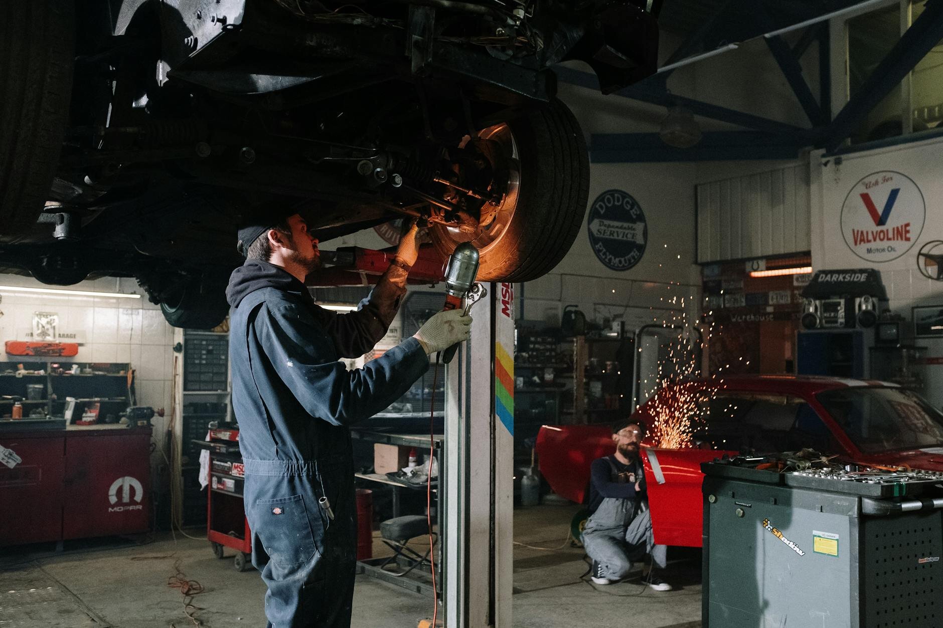 Image of mechanic working on car