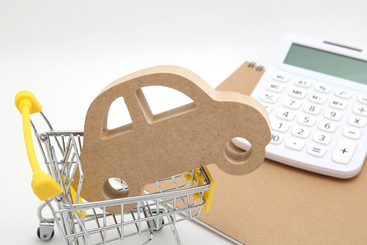 Paper car in miniature shopping cart