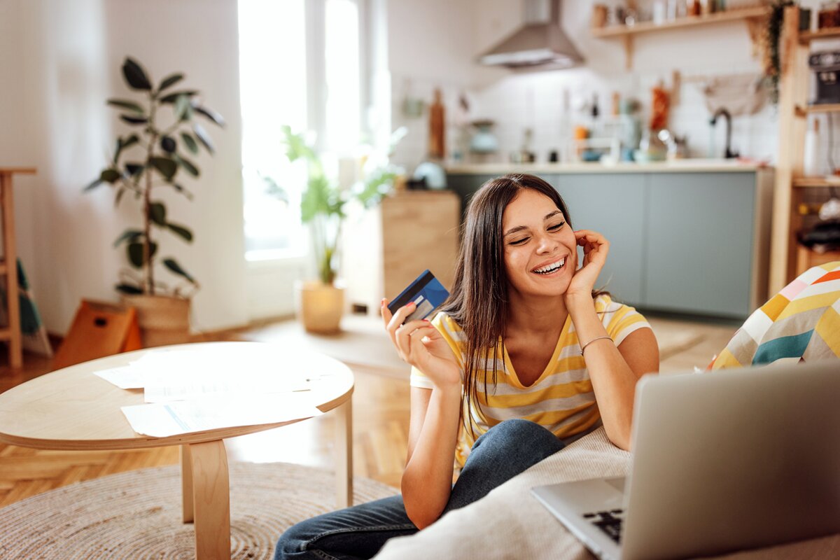 Girl at computer with first credit card