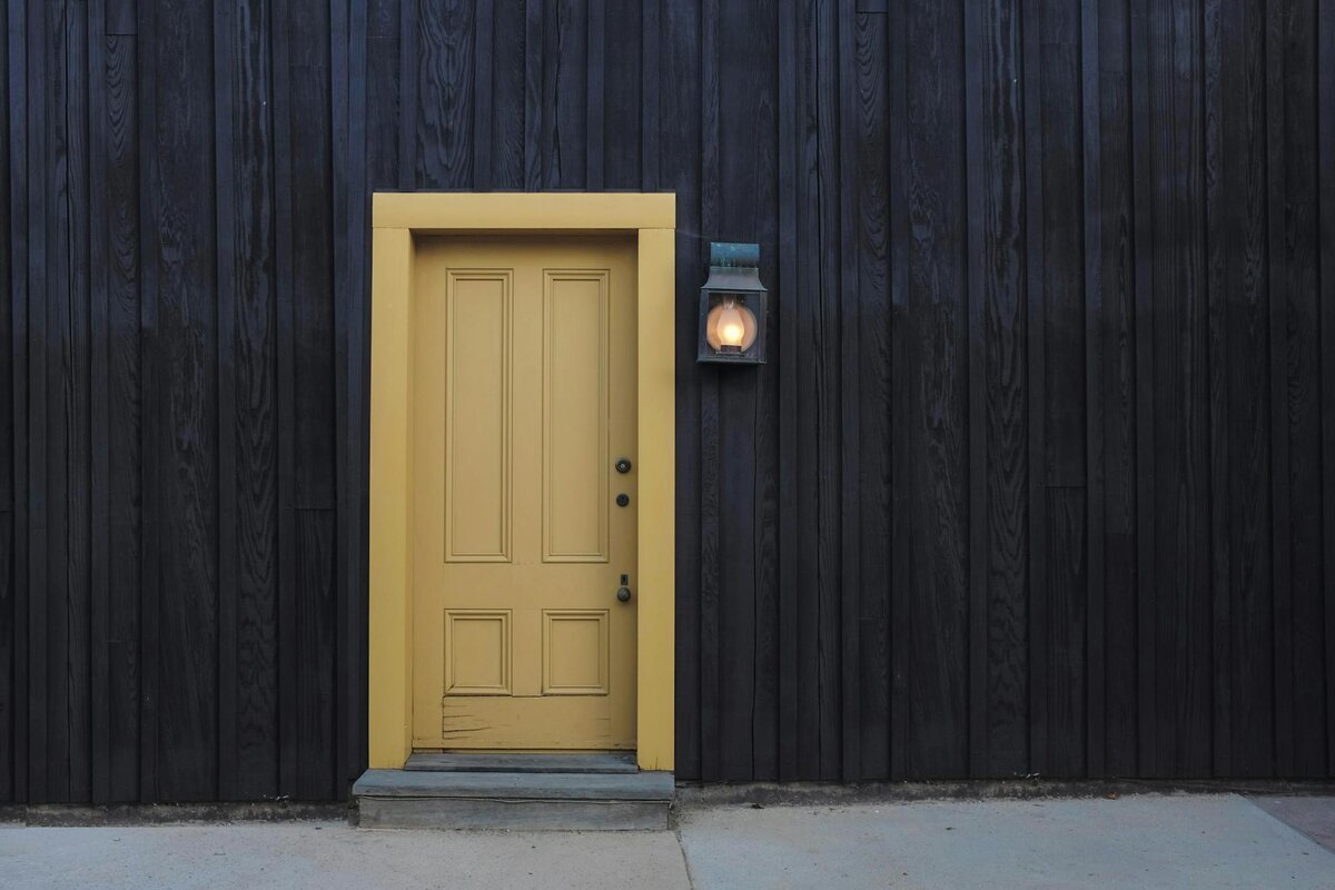 Image of house with yellow door