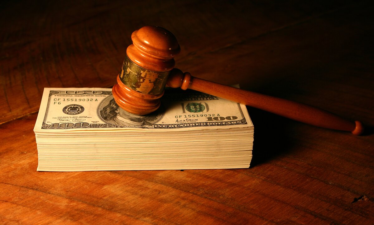 Gavel on stack of cash