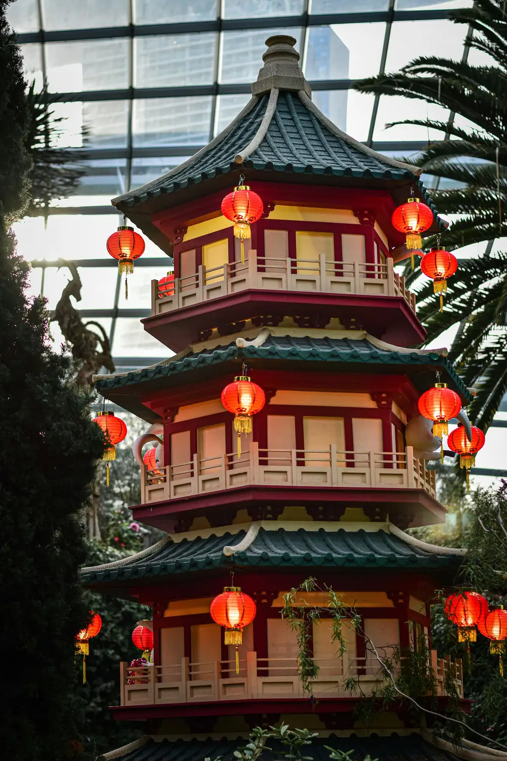 Traditional Chinese pagoda with red lanterns and decorative roof tiers inside Gardens by the Bay Singapore