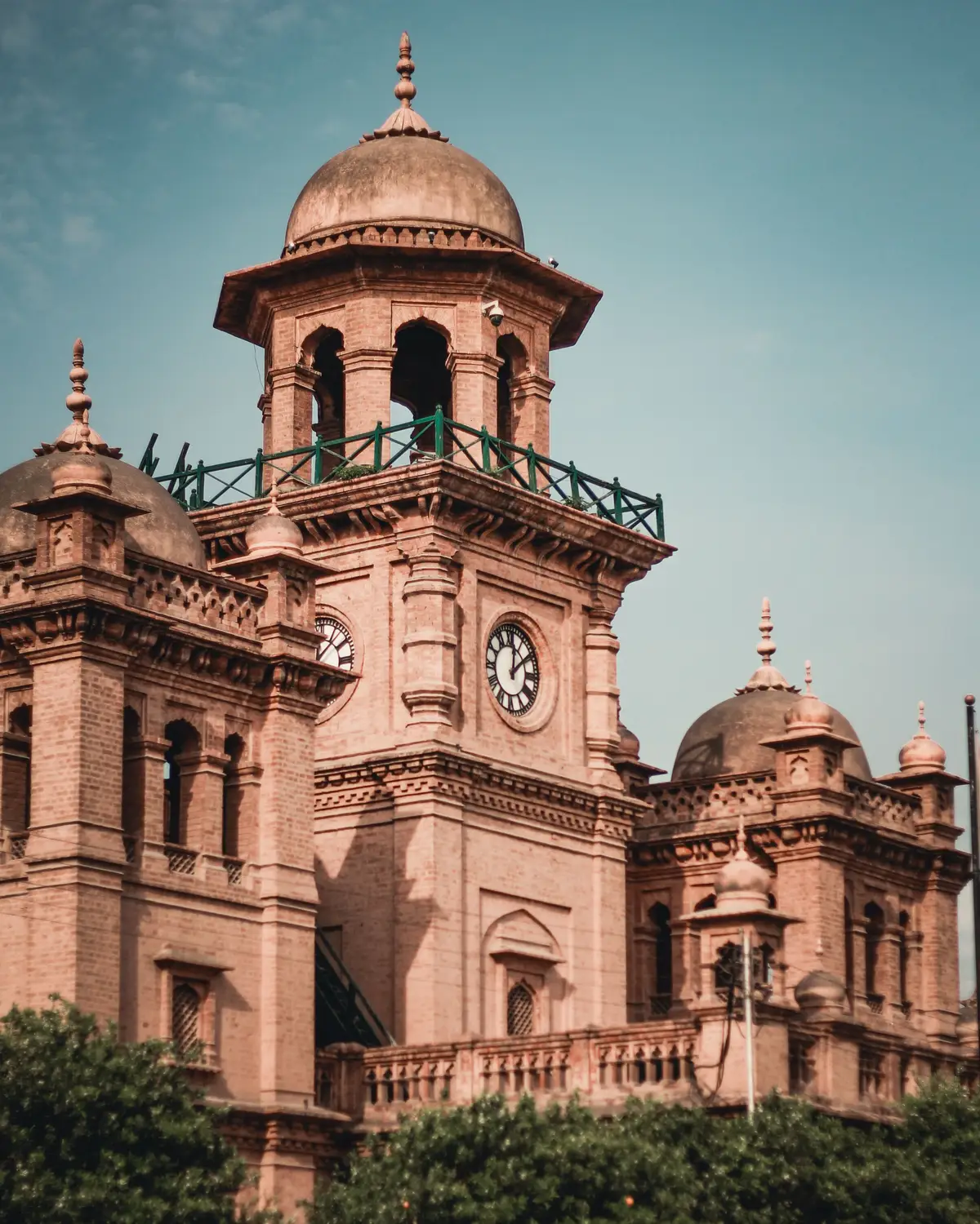 Lahore High Court colonial era pink sandstone building with clock tower Pakistan