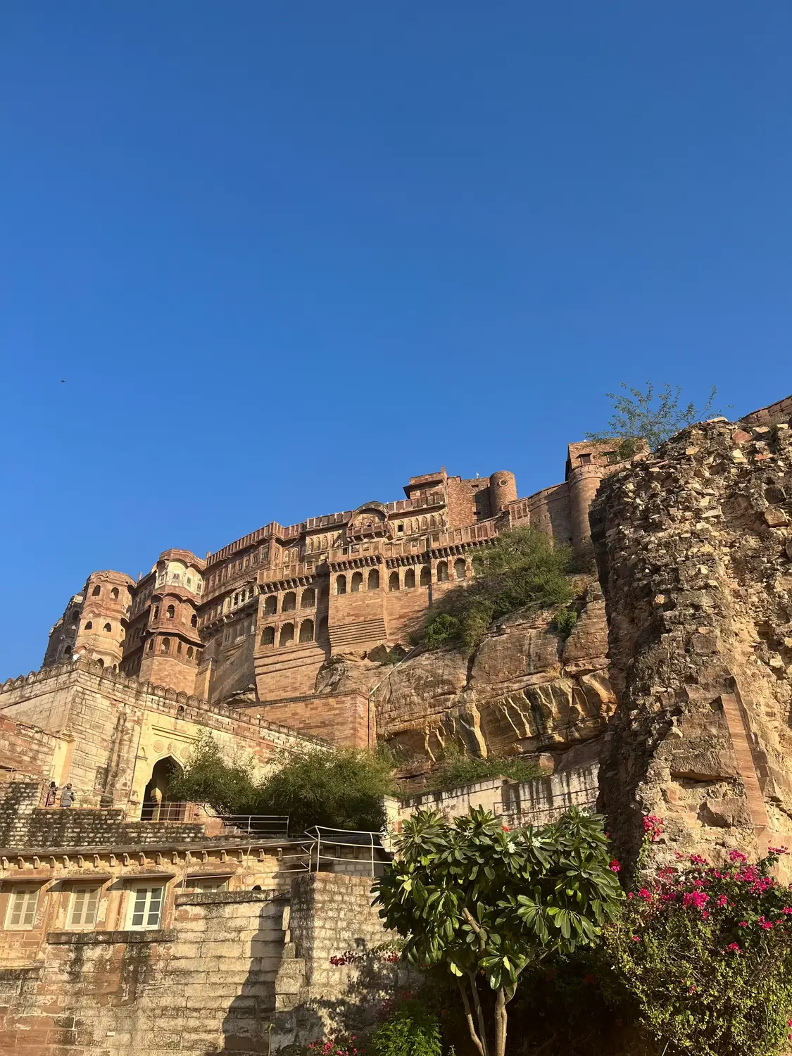 Mehrangarh Fort massive sandstone walls and palace rising dramatically from rocky hilltop, Jodhpur, Rajasthan, India