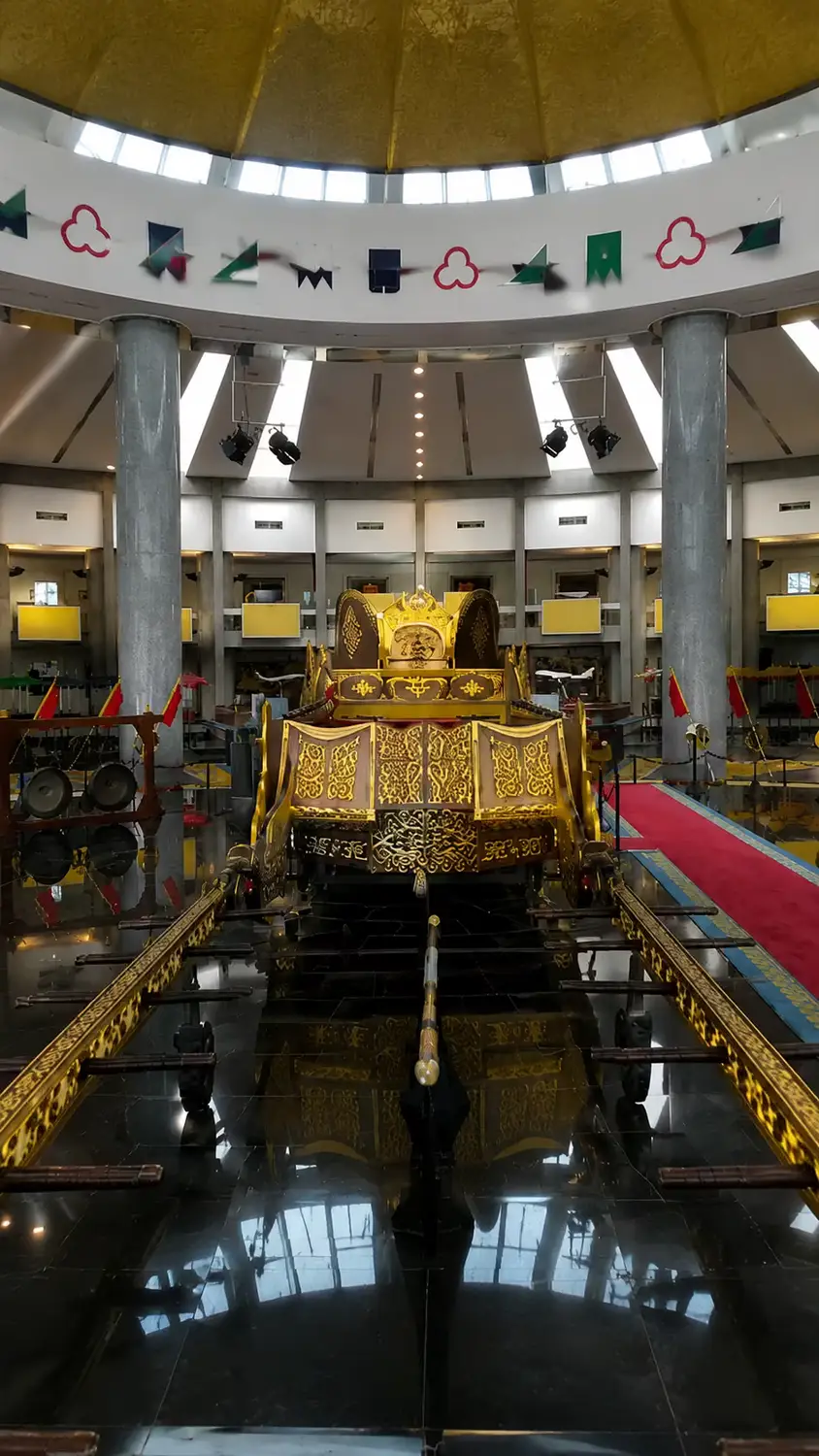 Royal ceremonial gold palanquin on display inside Royal Regalia Museum rotunda, Bandar Seri Begawan, Brunei