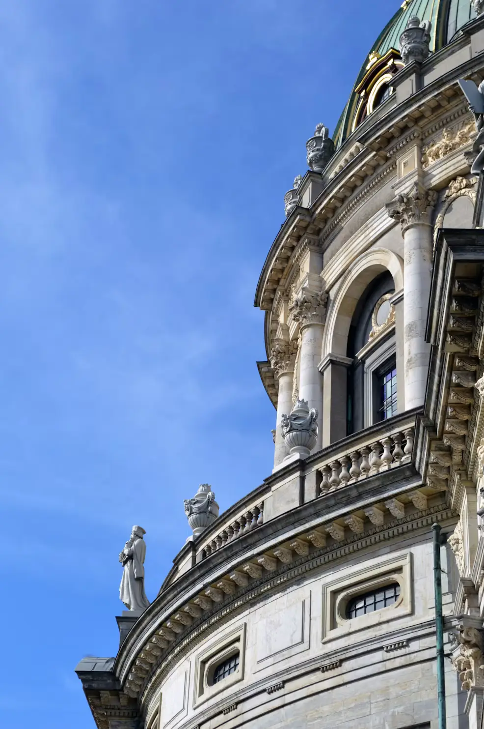 Close-up of ornate domed rooftop and statues on Frederik's Church in Copenhagen