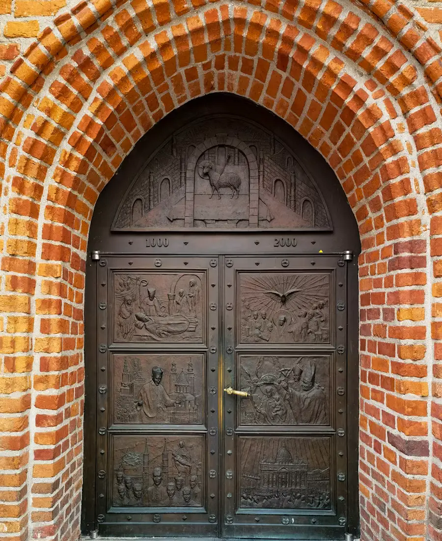 Close-up of an ornate wooden door set within a red brick arched doorway.