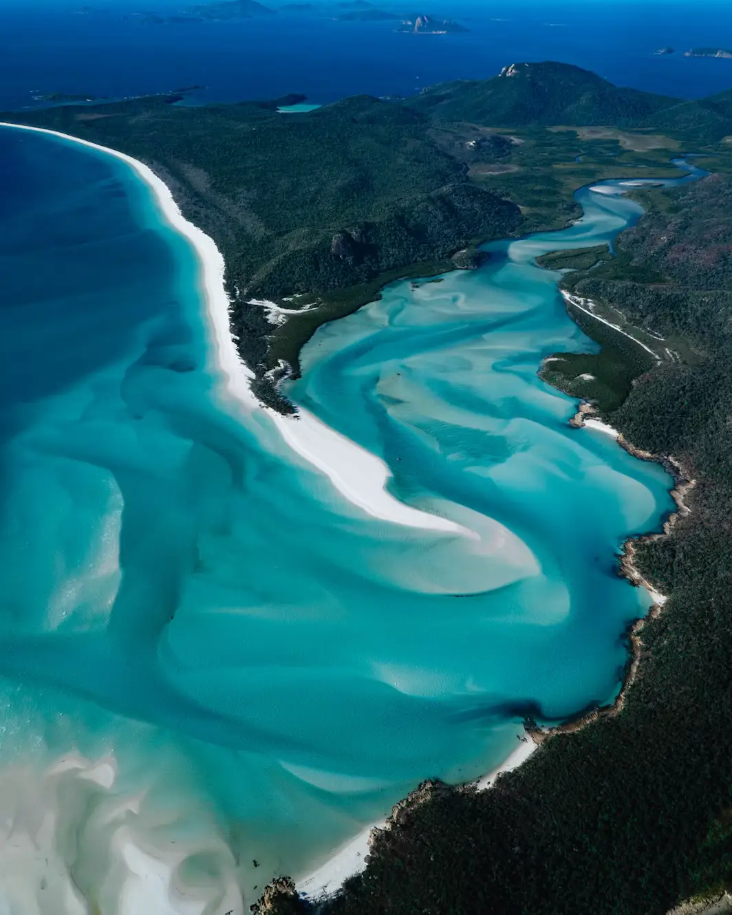 Aerial view of Whitehaven Beach's swirling turquoise water and white sand in the Whitsunday Islands, Australia