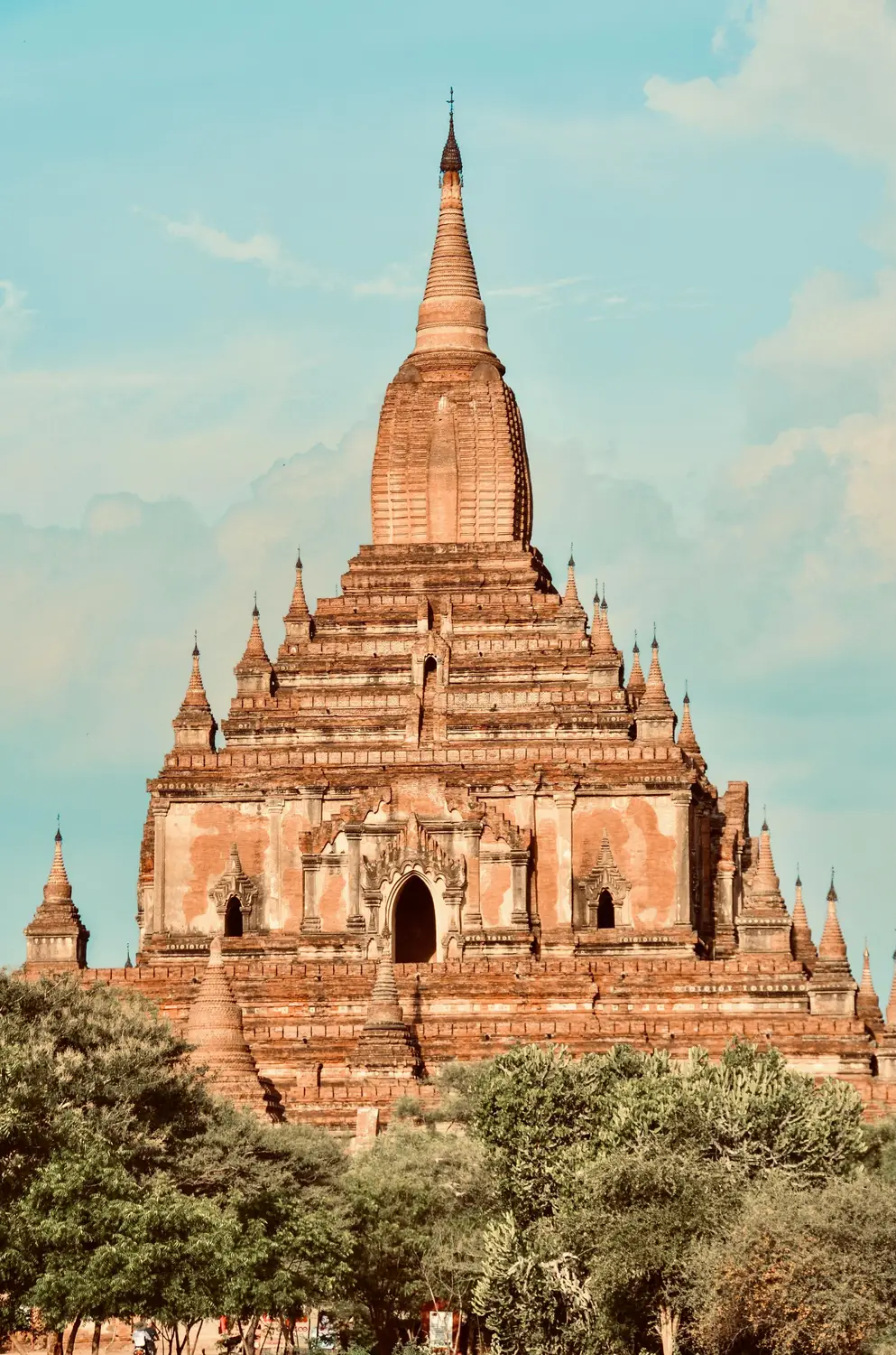 Ancient Buddhist temple in Bagan Myanmar with historic brick architecture under a blue sky