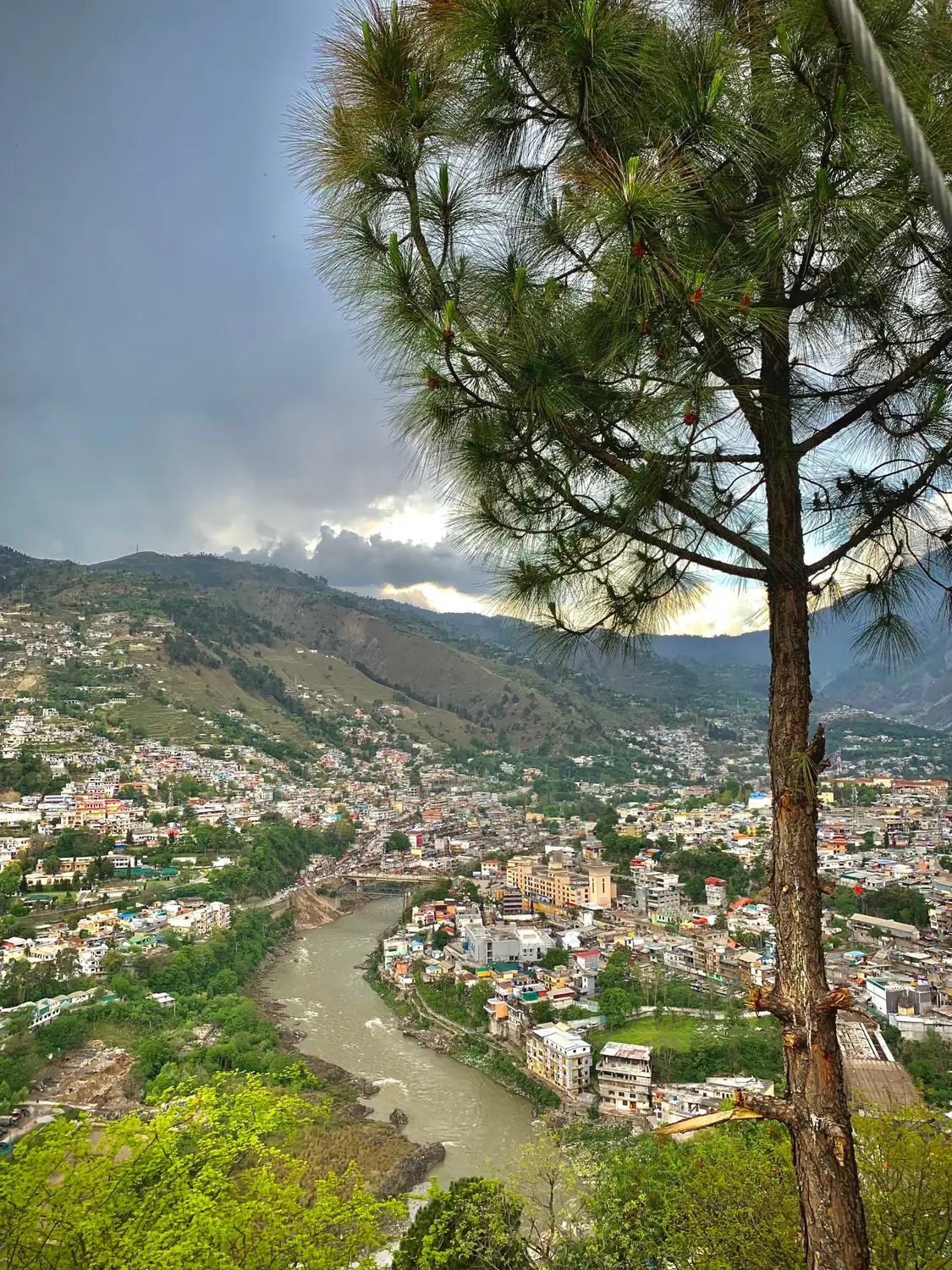 View of Gilgit city nestled in river valley surrounded by mountains Pakistan