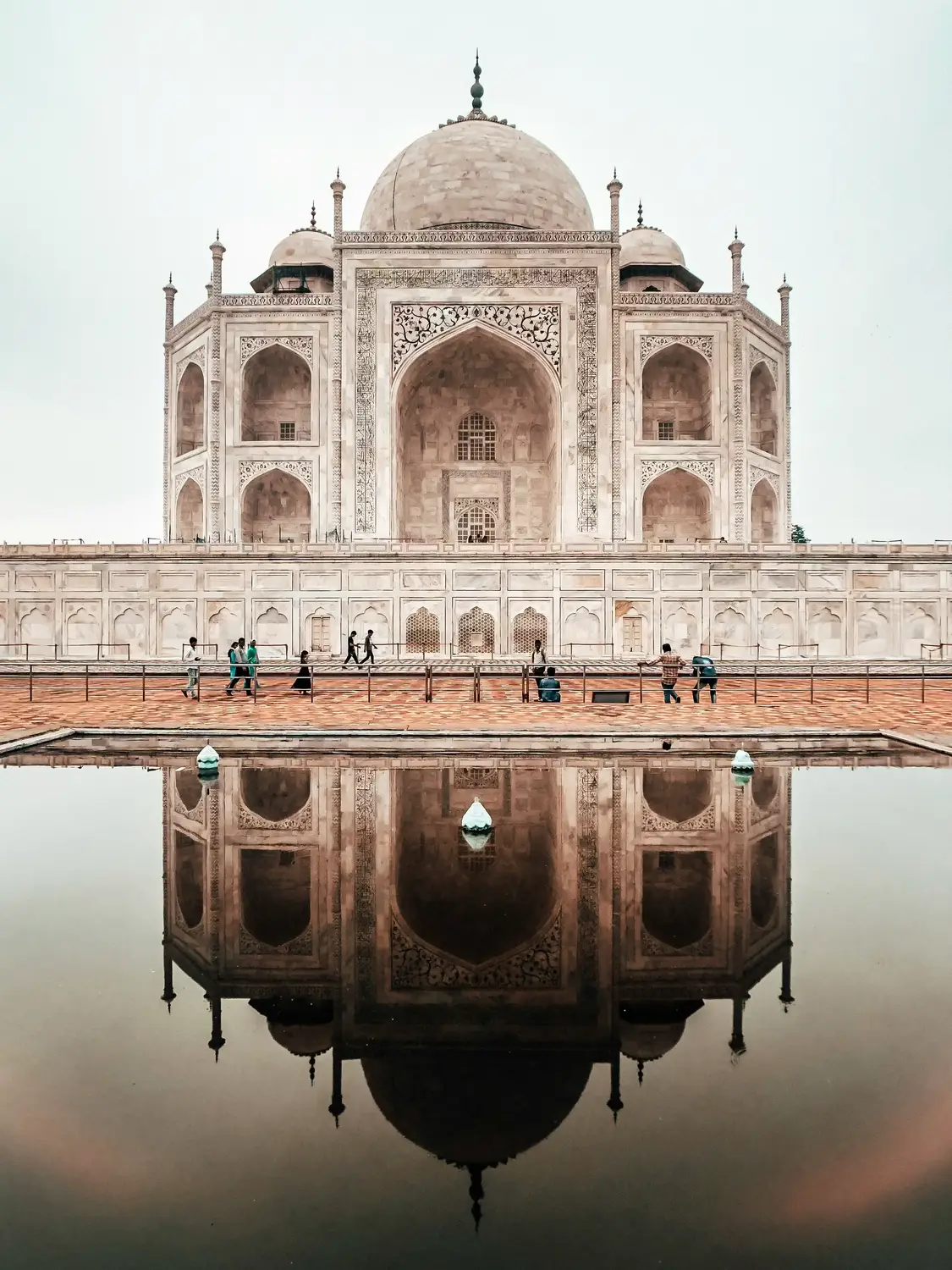 Taj Mahal white marble UNESCO mausoleum perfectly mirrored in still water pool, Agra, Uttar Pradesh, India