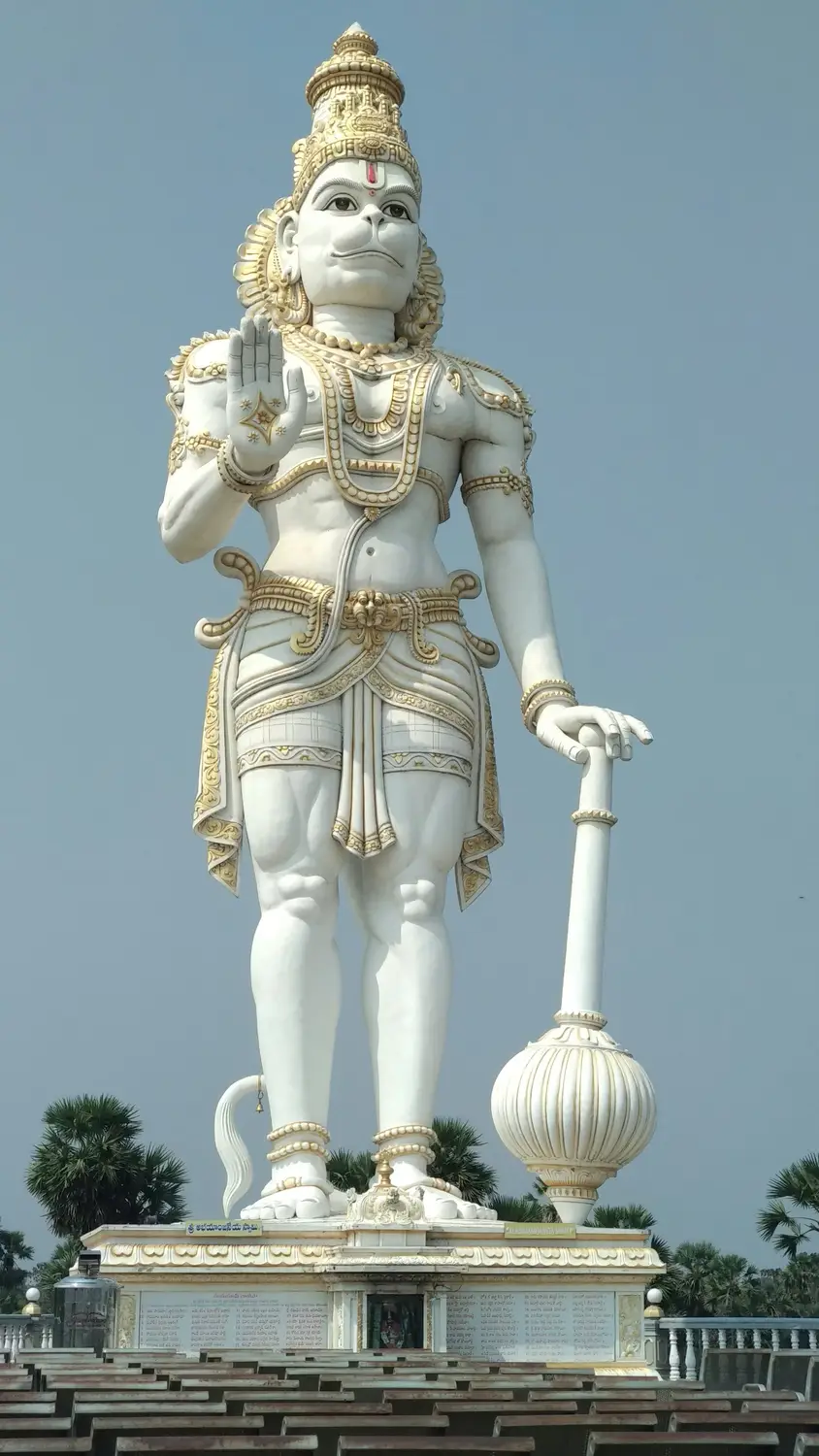 Giant white marble Lord Hanuman statue with gold ornaments holding mace, Hindu religious monument, Andhra Pradesh, India