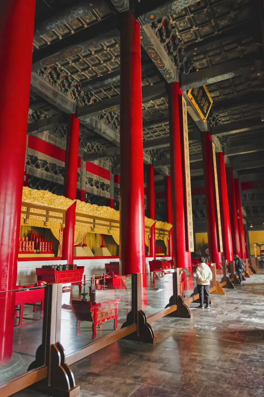 Interior of the Forbidden City Beijing with red lacquered columns gold imperial throne and ornate painted ceiling