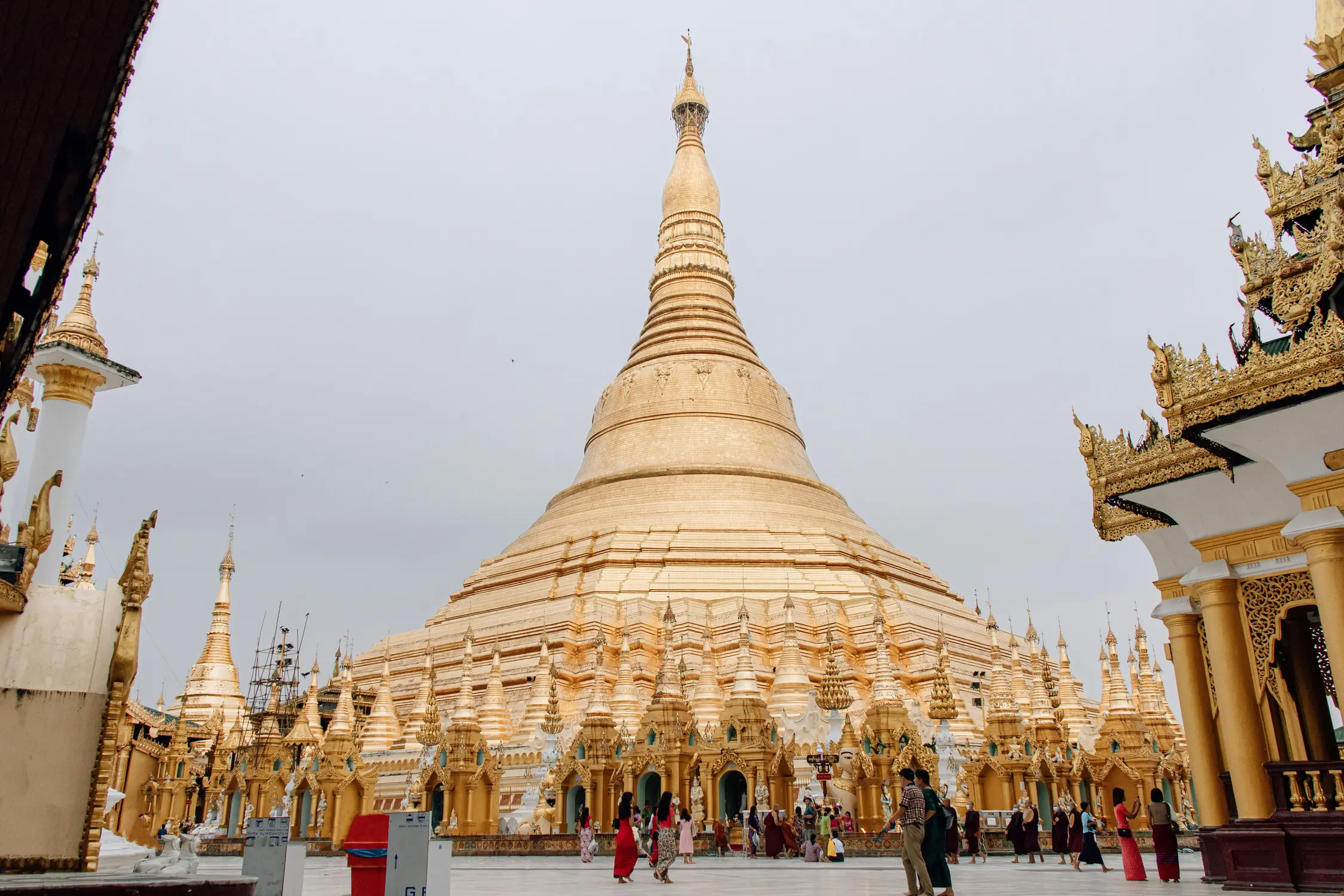 Shwedagon Pagoda golden stupa with visitors at the temple complex in Yangon Myanmar