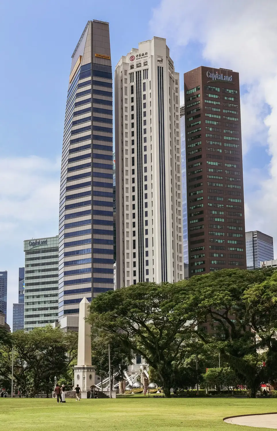Modern skyscrapers and green parkland at Raffles Place Singapore financial district
