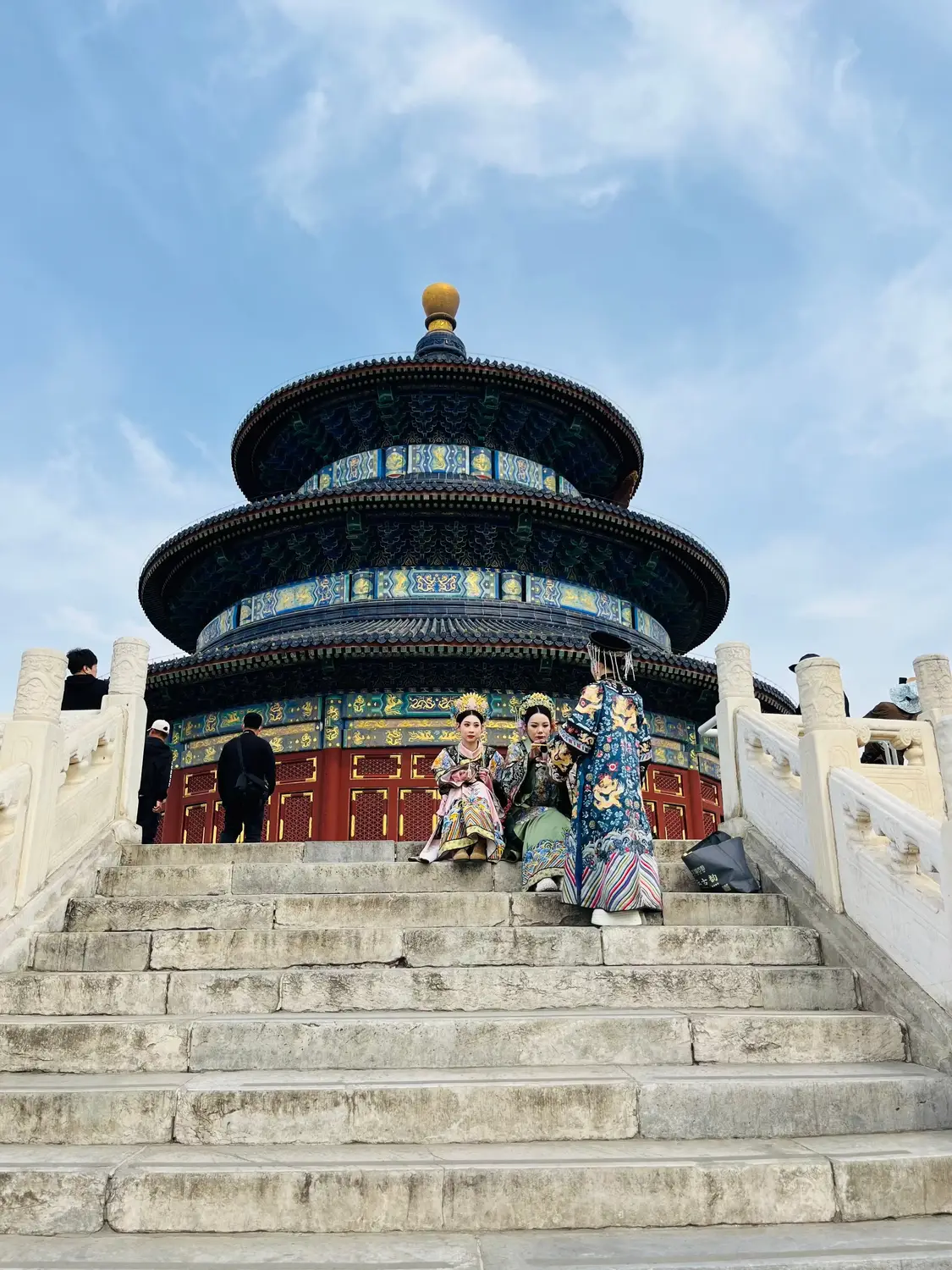 Temple of Heaven Hall of Prayer for Good Harvests Beijing with visitors in traditional Qing dynasty imperial costumes