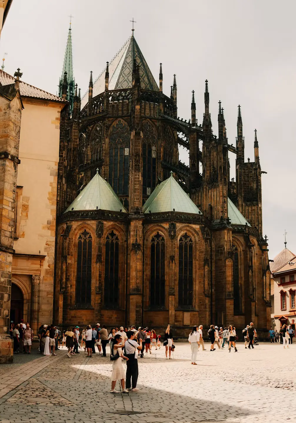 Visitors gathered outside the Gothic exterior of St. Vitus Cathedral