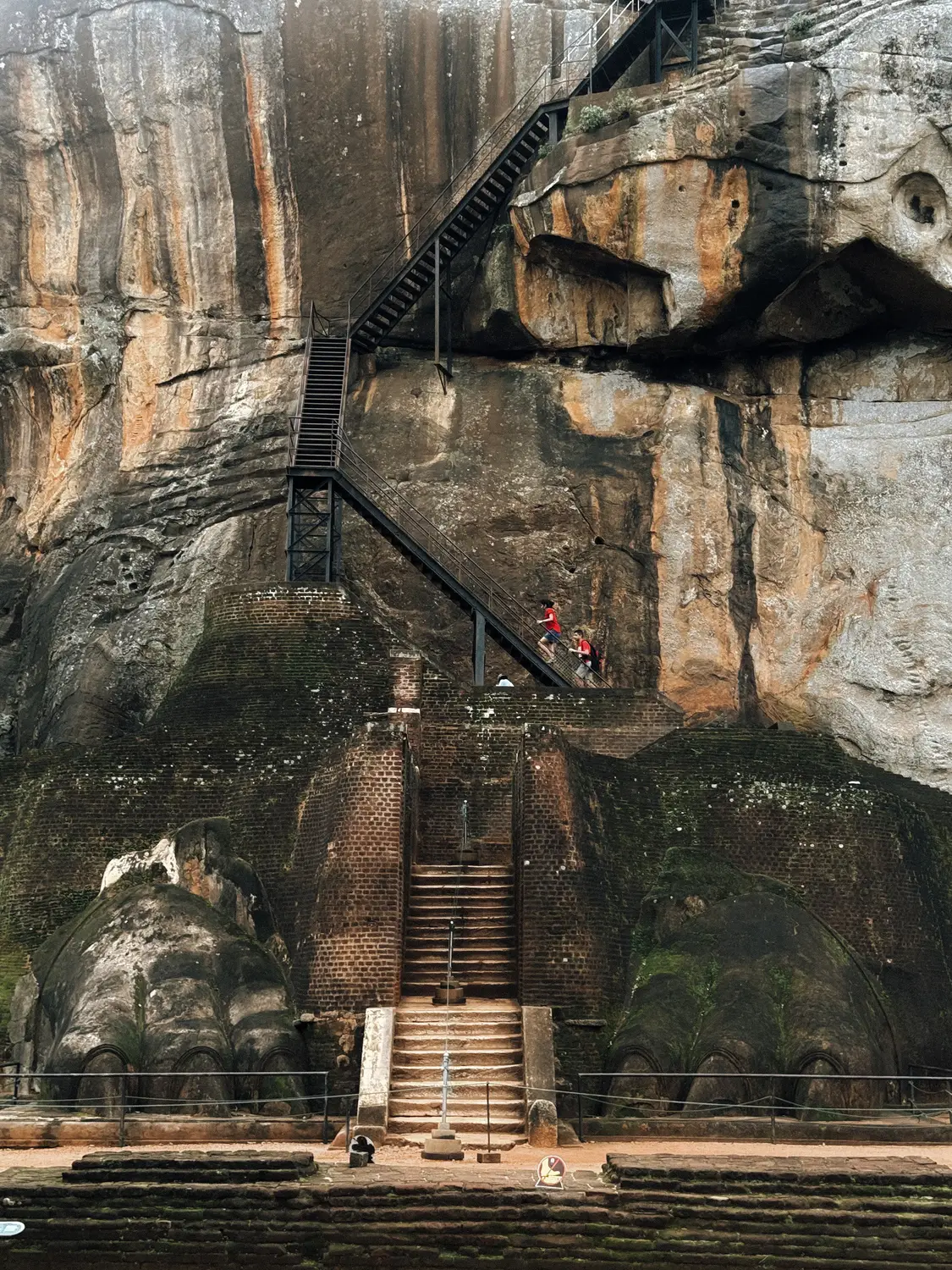 Ancient Lion's Paw staircase and rock face at the base of Sigiriya rock fortress in Sri Lanka.