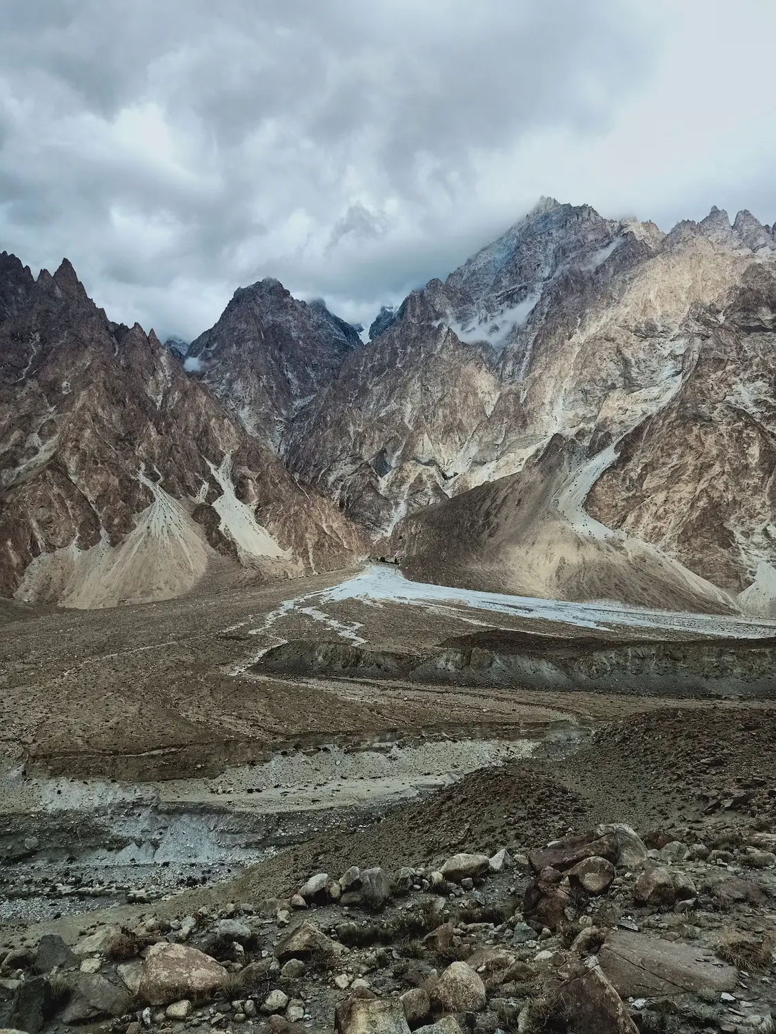 Rocky barren mountain landscape with winding river valley Karakoram Highway Pakistan