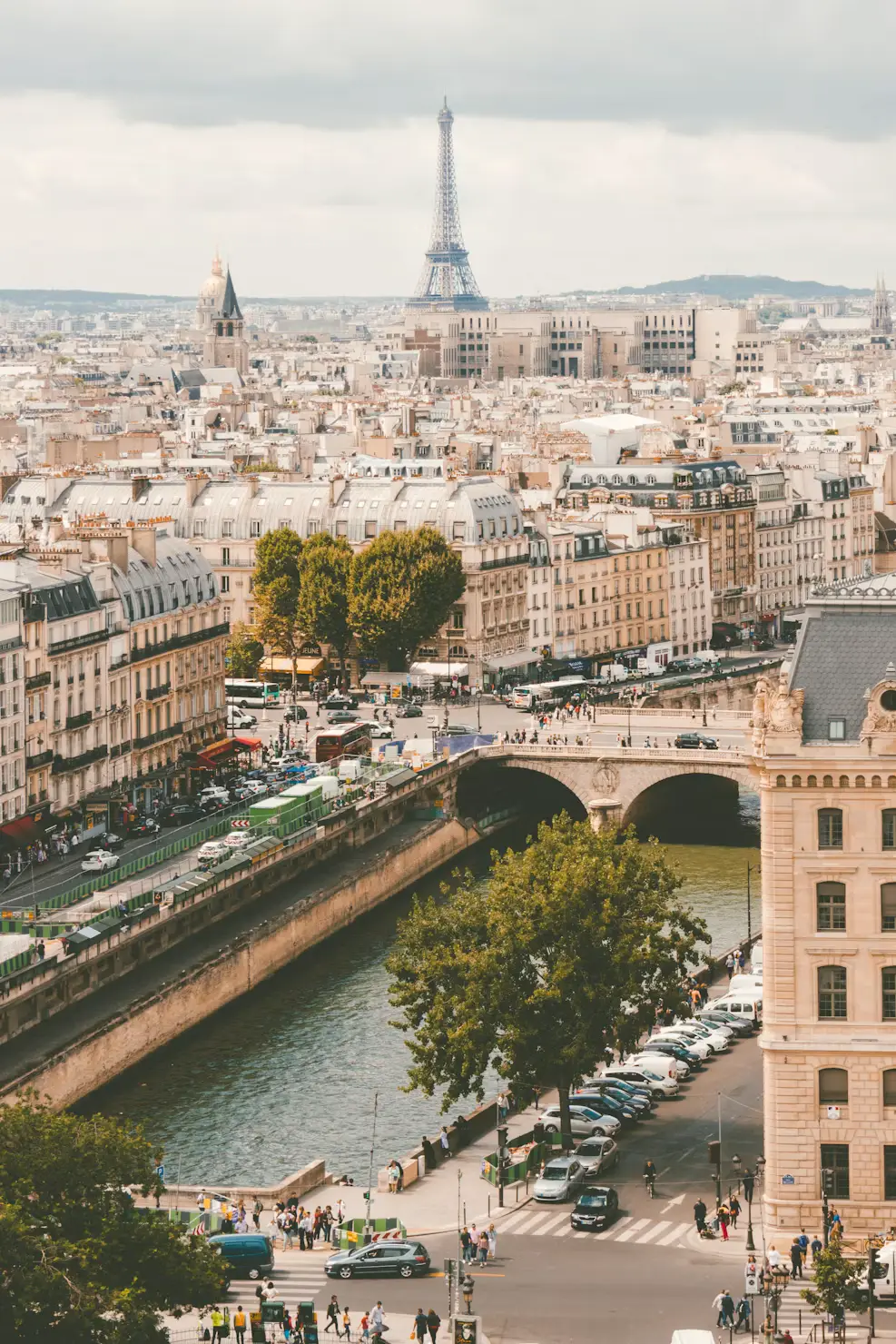 Aerial view of Paris with the Seine River, Pont de Sully bridge, and Eiffel Tower in the distance