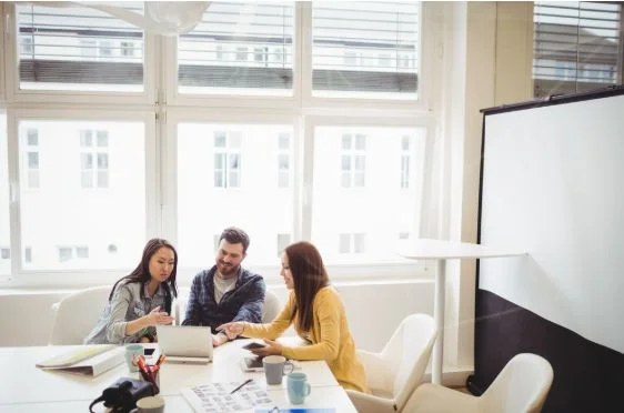 Team meeting discussing ERP implementation