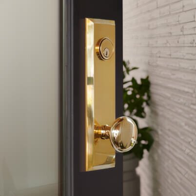 open door focusing on gold door knob