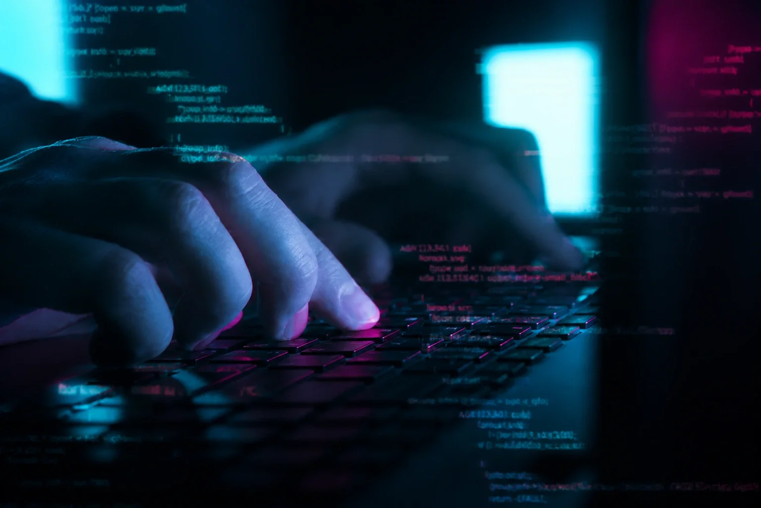 Person typing on a keyboard