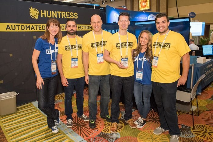 Huntress Employees receiving an award