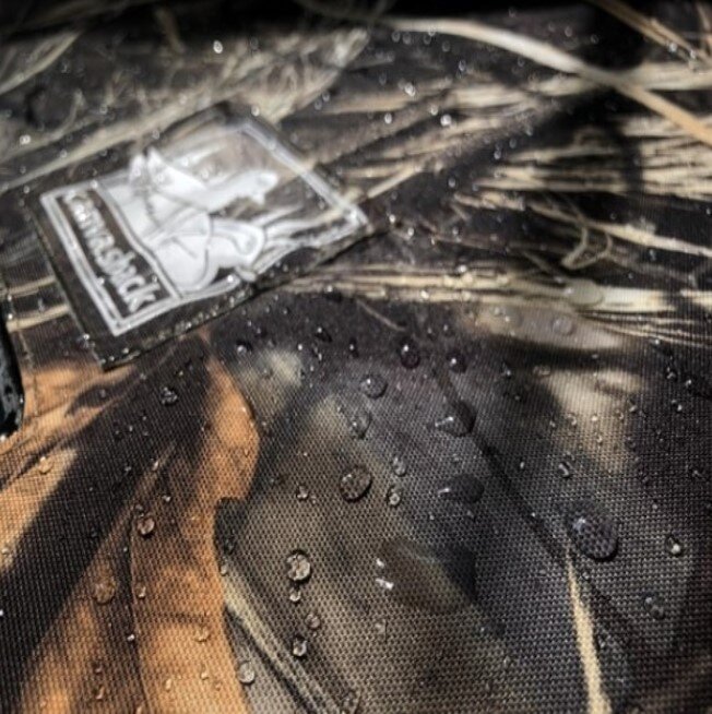 Water repellant Camo Canvasback fabric close up with water droplets