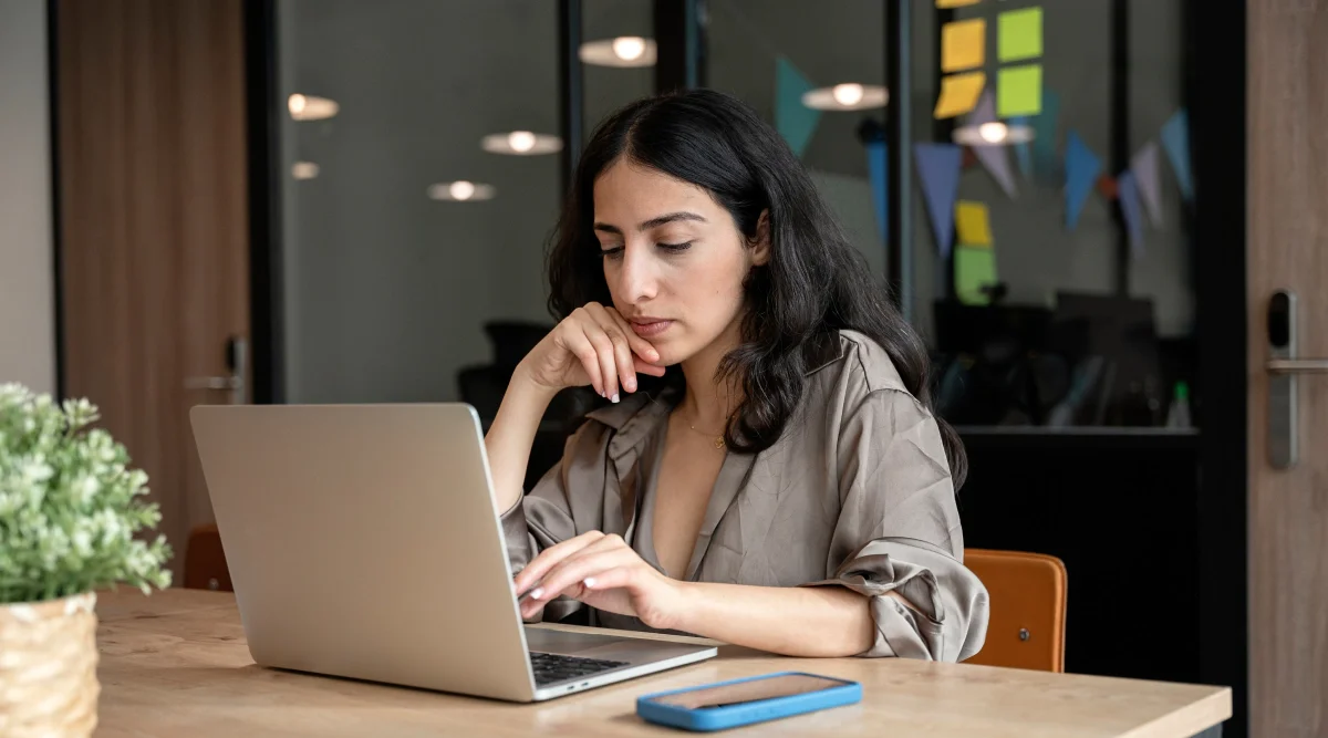 A woman is reading about the essential estate planning tips before a surgery on her laptop.