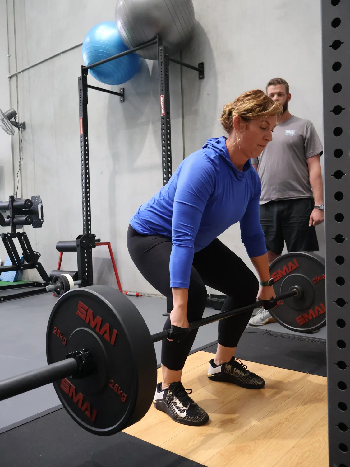 Professional strength training session at Fortify Personal Training Altona North - female client performing deadlift with expert guidance