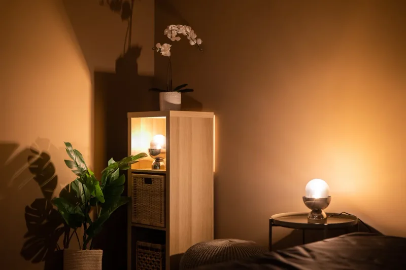 Warm ambient corridor leading to private massage rooms