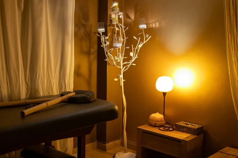 Candlelit corridor leading to treatment rooms inside the Stimulos erotic spa