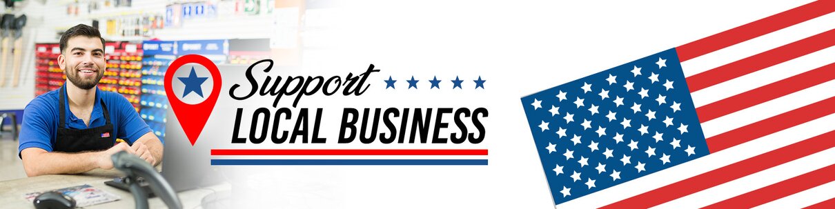 Male hardware store clerk, happy, looking at the camera while standing behind a counter at a local hardware store, USA flag graphics