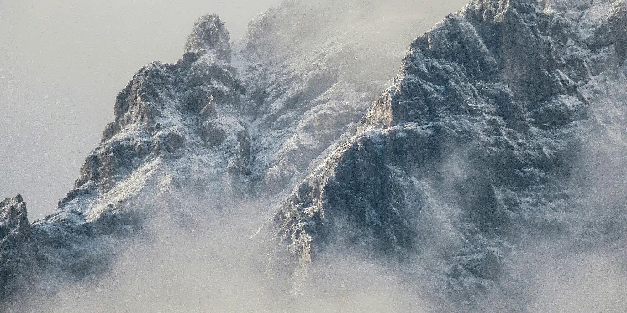 Hero Banner of mountain with snow and fog