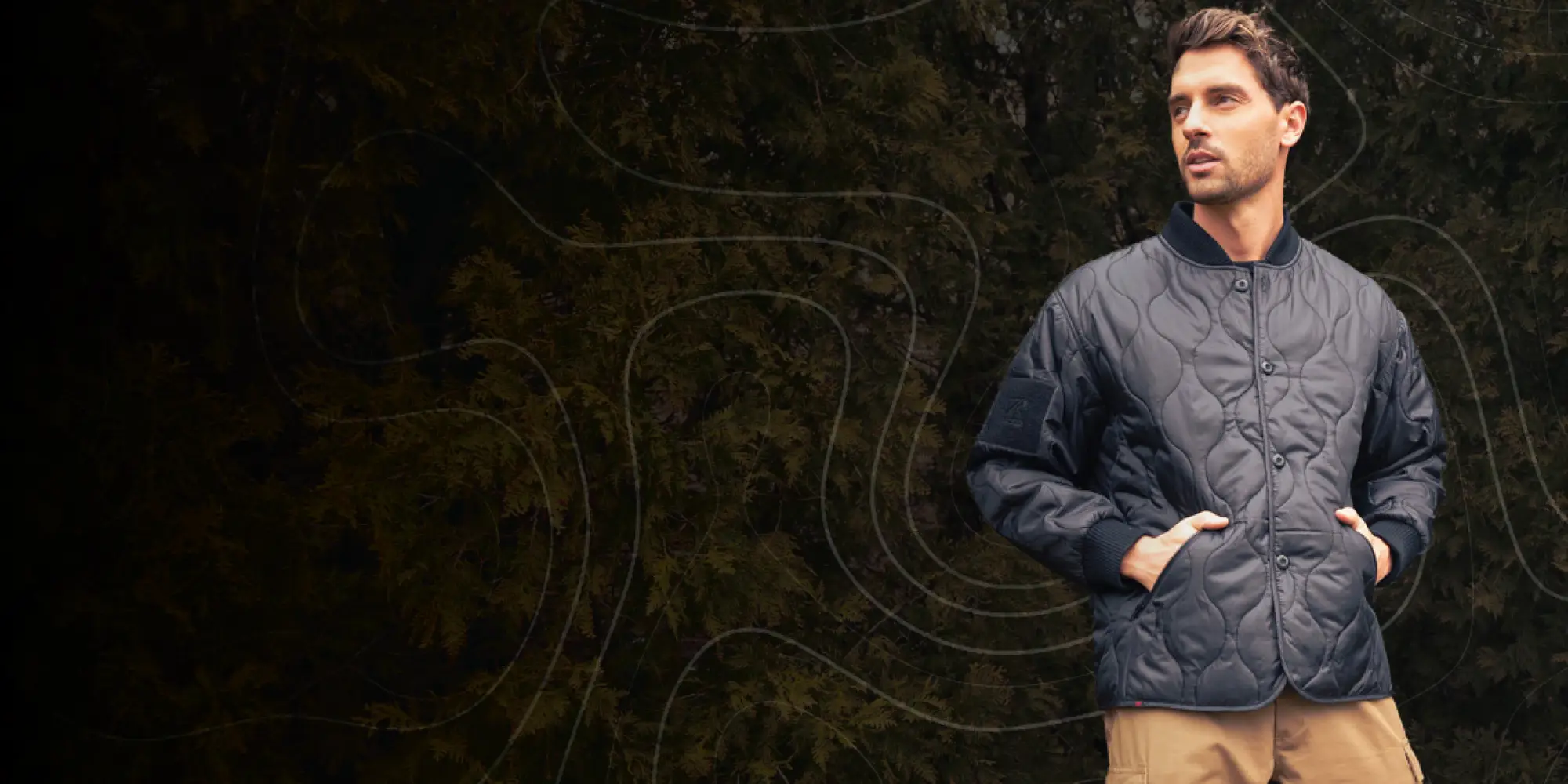 Man Wearing Woobie Jacket Outdoors with Graphic Overlay