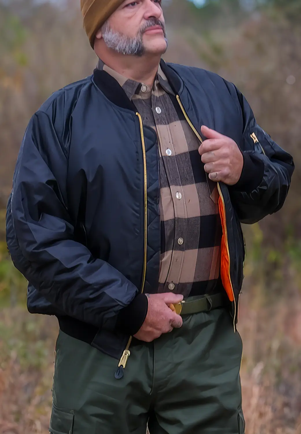 man in black flight jacket