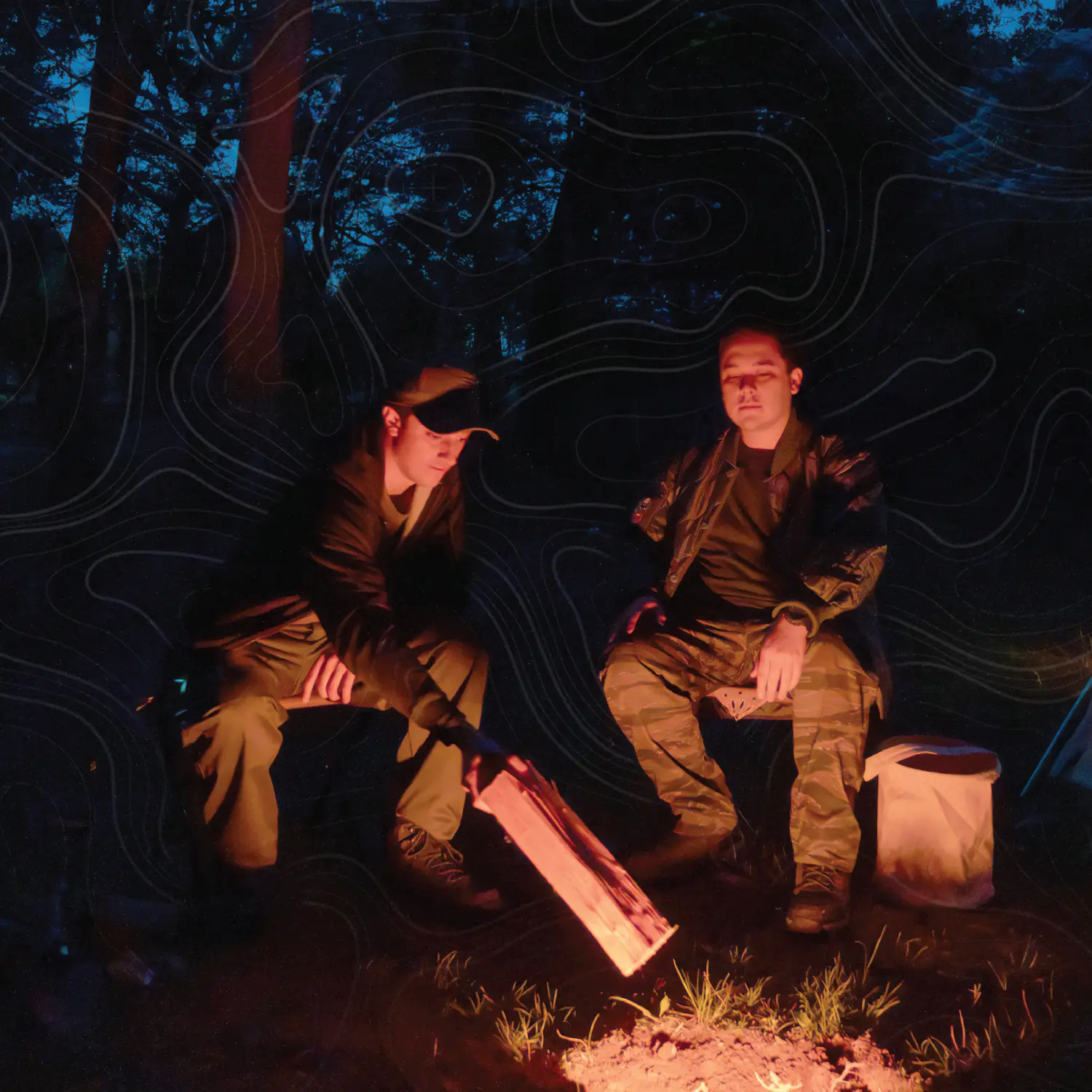 Nighttime camping image by fire
