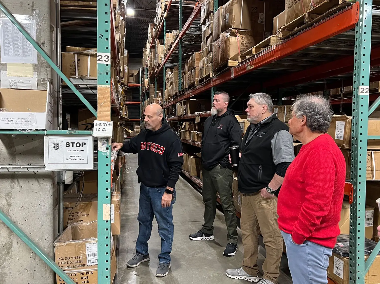 Howard Somberg listening to the warehouse staff