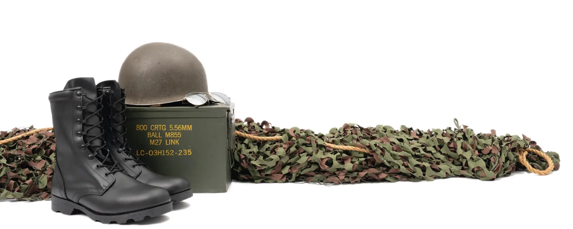 Military boots, helmet, and ammo can