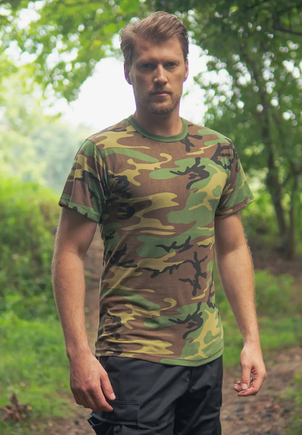 Man Camo Tee shirt and pile of shirts