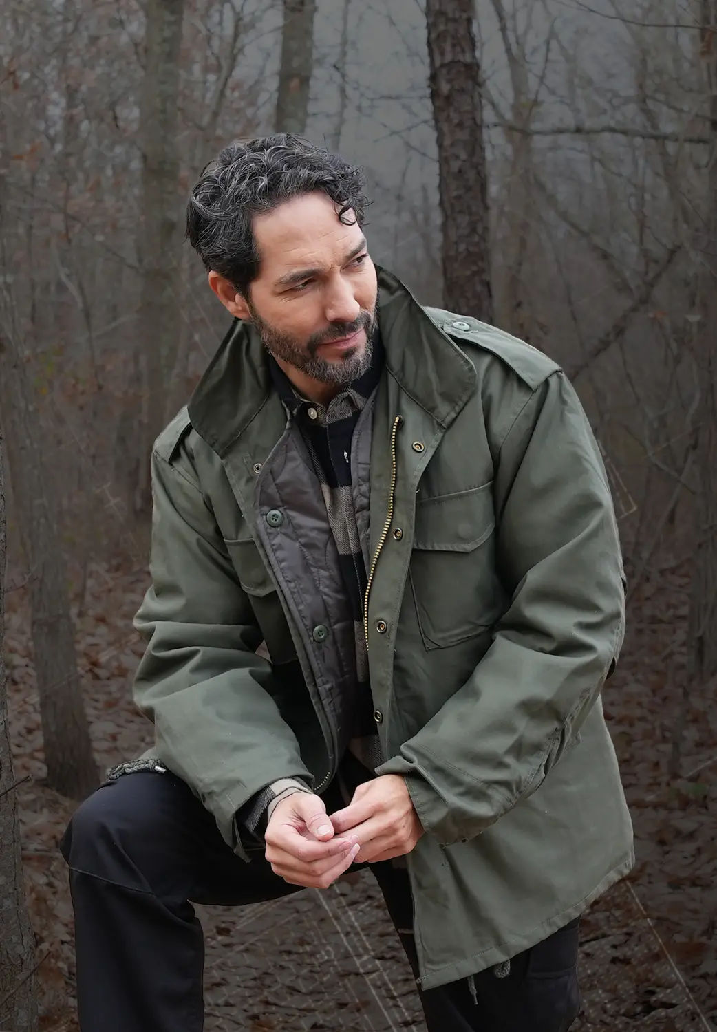 Man Wearing Woobie Jacket Outdoors with Graphic Overlay