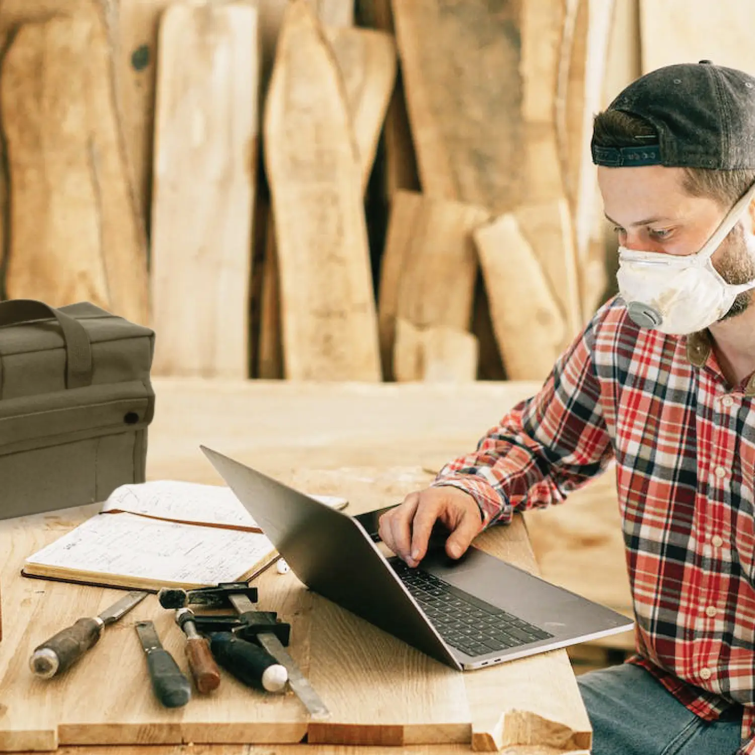 man on laptop at jobsite