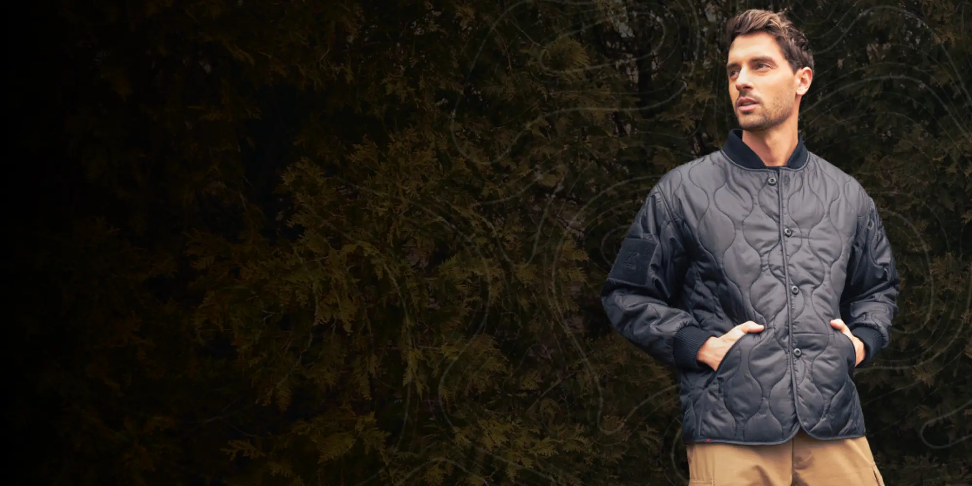 Man Wearing Woobie Jacket Outdoors with Graphic Overlay