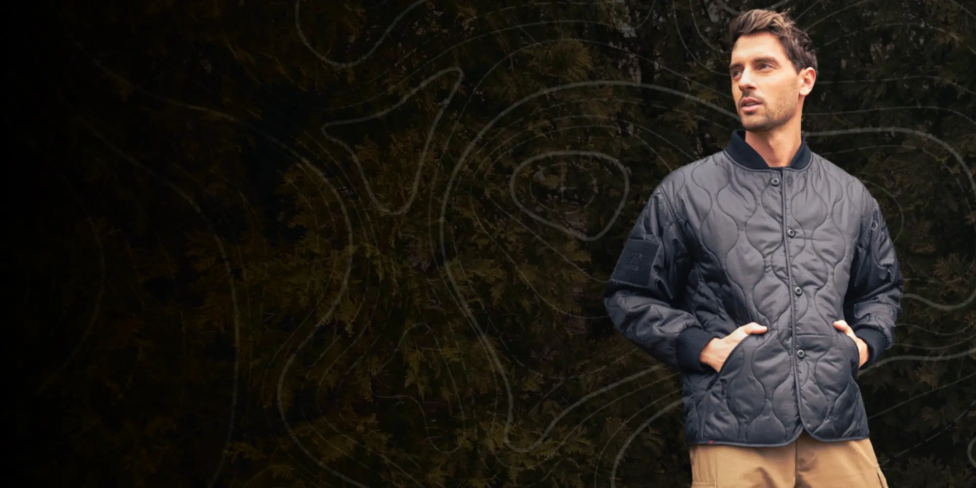 Man Wearing Woobie Jacket Outdoors with Graphic Overlay