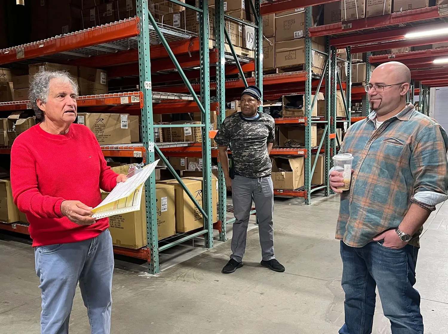 Howard Somberg going over the warehouse's plan
